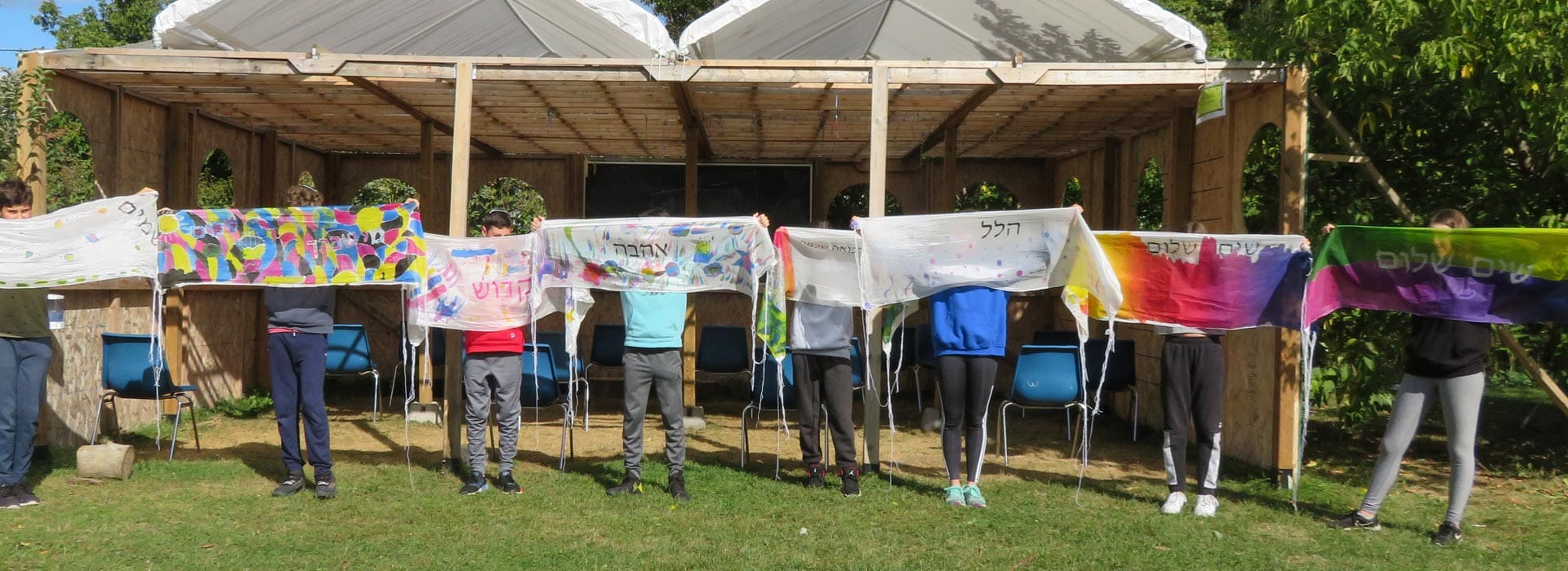 Students holding tallits
