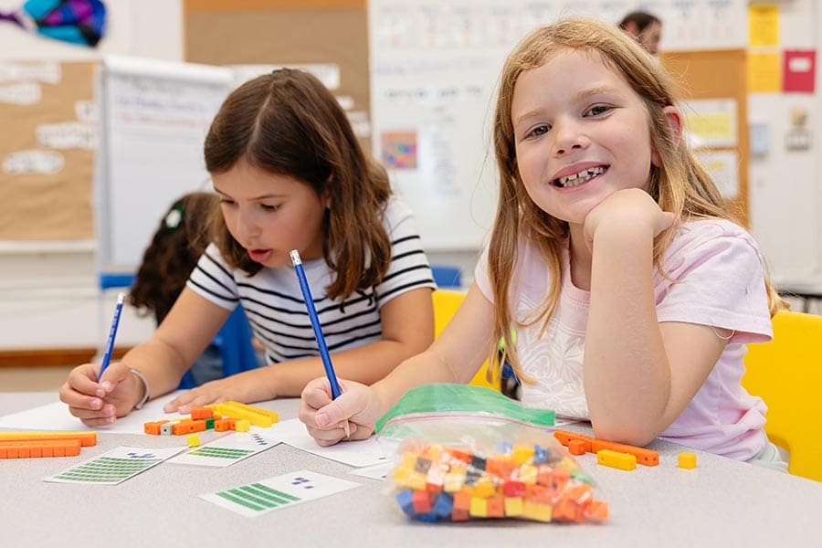 Two young female students in the classroom