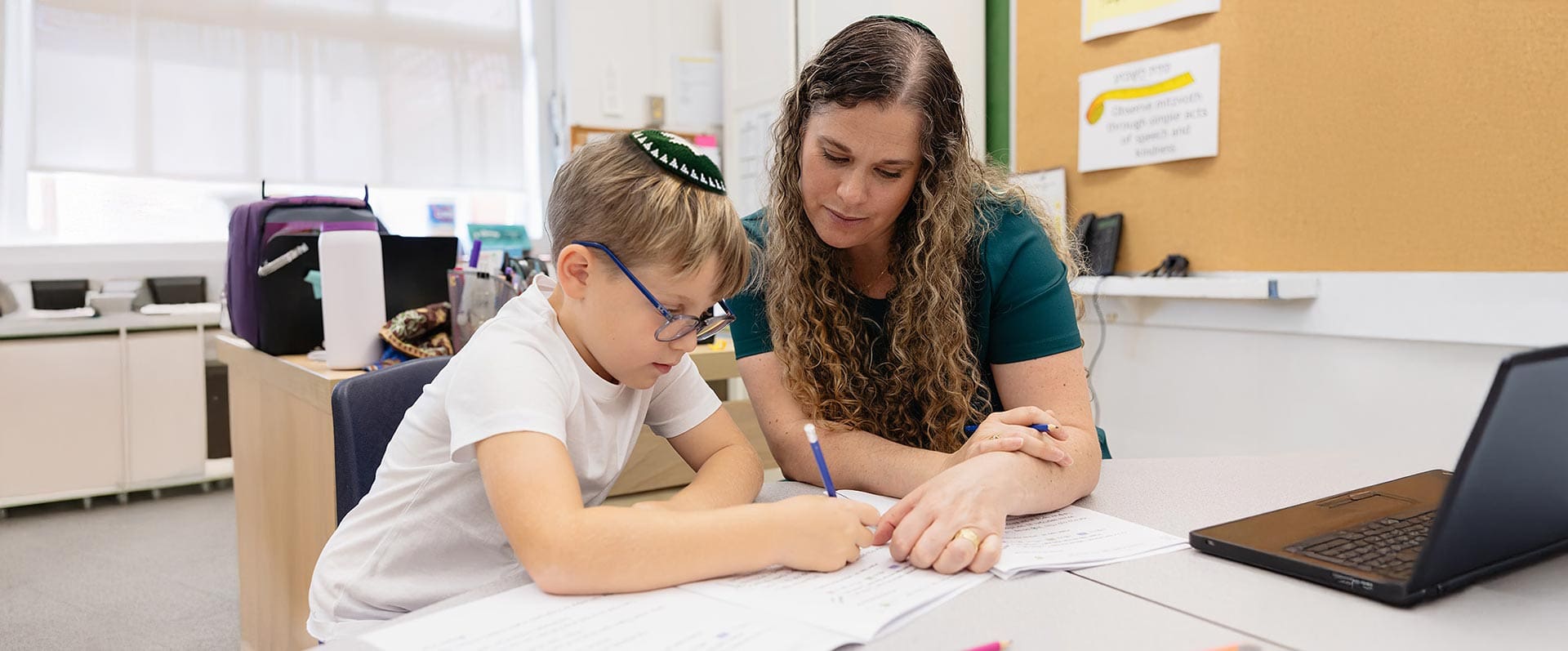 Student Support and Enrichment - teacher supporting student
